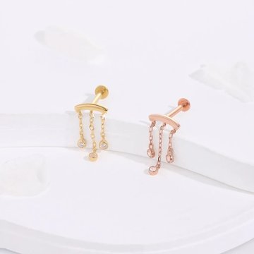 Hidden helix piercing with mixed metal jewelry combination