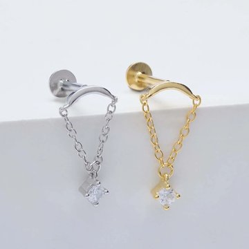 Hidden helix piercing with silver stud and gemstone