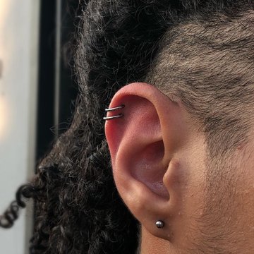 Double forward helix piercing with small crystal studs