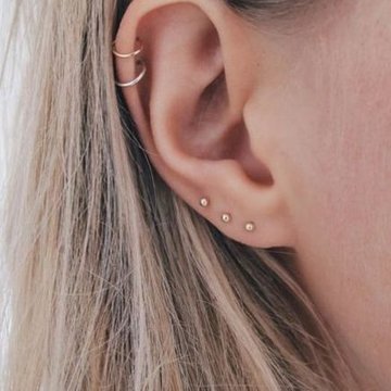 Pretty double helix piercing
