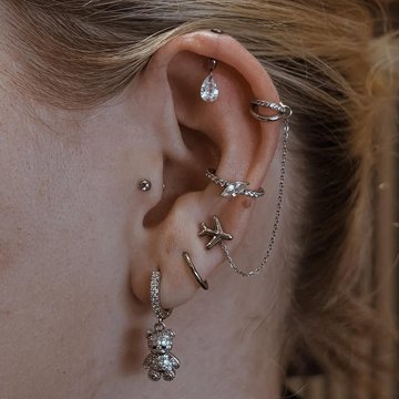 Vertical helix piercing with gemstone hoop