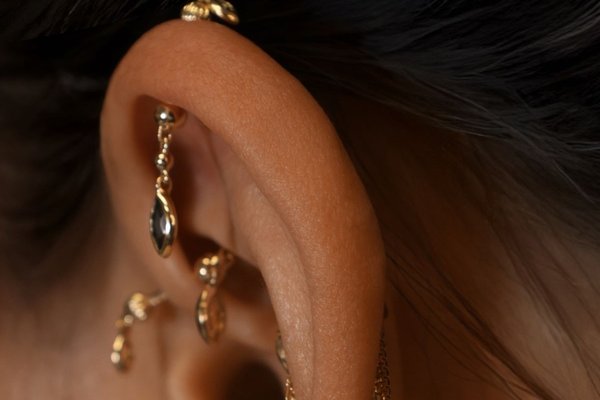 Vertical helix piercing with gemstone stud and hoop