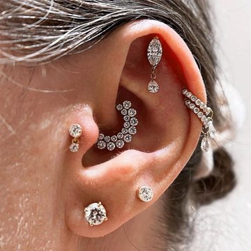 Horizontal and vertical helix piercings combined