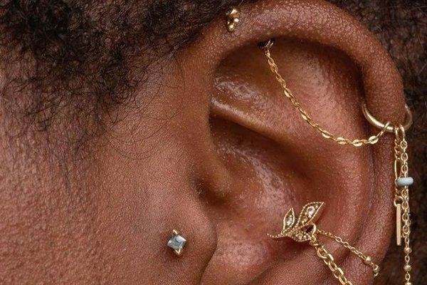 Vertical helix piercing with gemstone stud and hoop