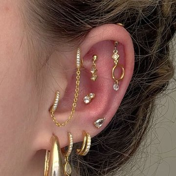 Vertical helix piercing with sparkling diamond stud