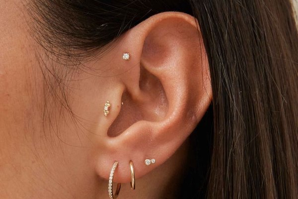 Forward helix piercing close-up with stud jewelry