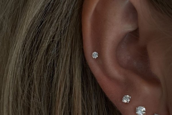 Pretty mid helix piercing with crystal studs