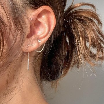 Double mid helix piercing with asymmetrical jewelry