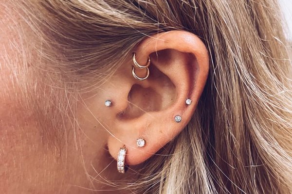 Mid helix piercing paired with tragus