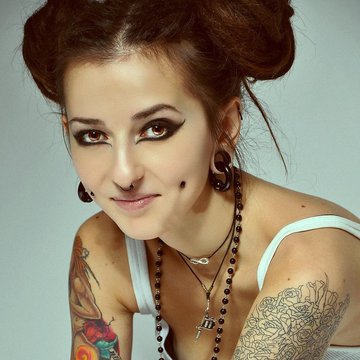 Female model showing upper cheek piercing placement
