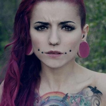 Female model showing upper cheek piercing placement