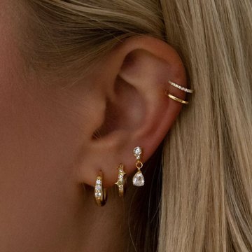 Double flat helix piercing on upper cartilage