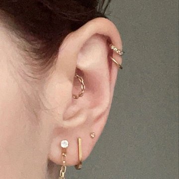 Double helix ear piercing combined with lobe studs