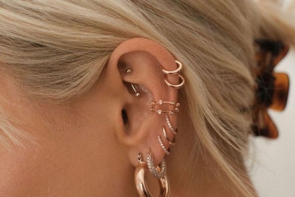 Double mid helix piercing with two gold hoops