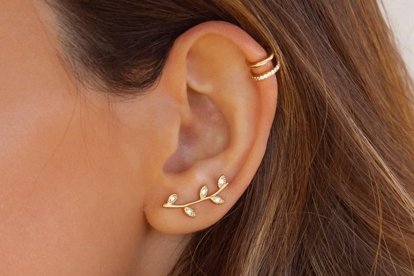Close-up of freshly done double helix piercing
