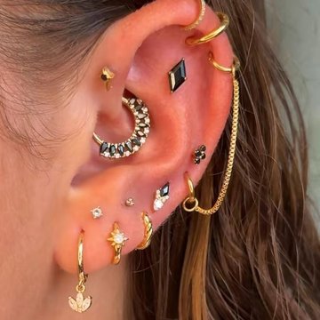 Pretty double helix piercing with sparkling opal studs