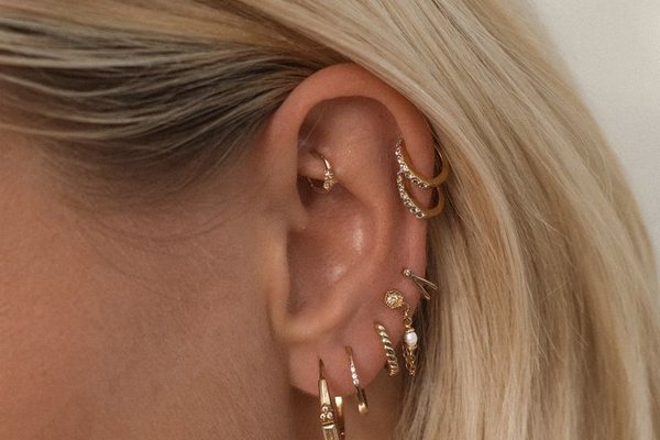 Double flat helix piercing on upper cartilage