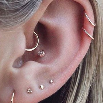 Minimalist titanium jewelry in double helix piercing