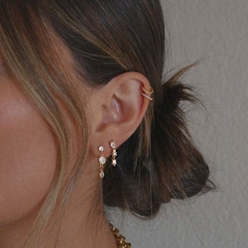 Double helix piercing ideas with mixed jewelry styles