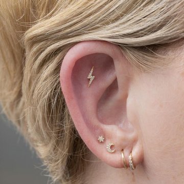 Stylish flat helix piercing with gemstone stud
