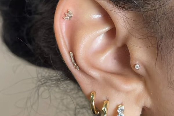 Flat back helix piercing close-up inside ear
