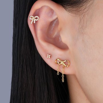 Artistic ear design highlighting double helix piercing