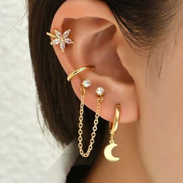 Stylish female ear with conch and mid helix in silver hoops