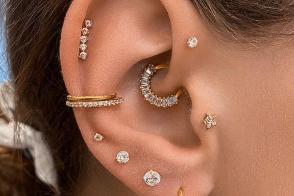 Conch and mid helix piercing paired with tragus