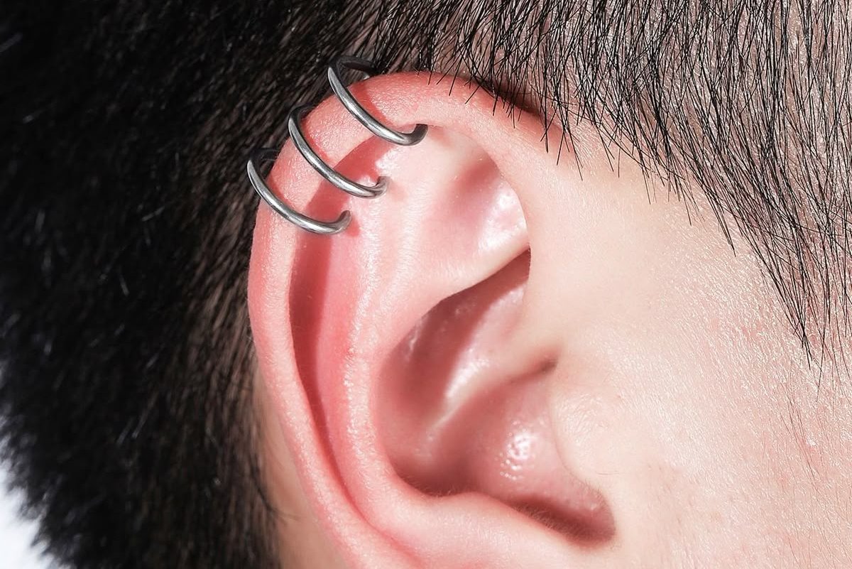 Triple helix piercing for men