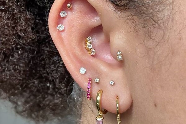 Triple helix piercing close-up with three studs