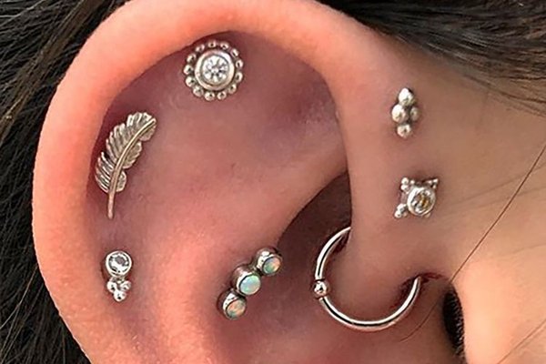 Triple helix piercing combined with rook piercing