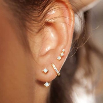Double low helix piercing with gradient gemstones