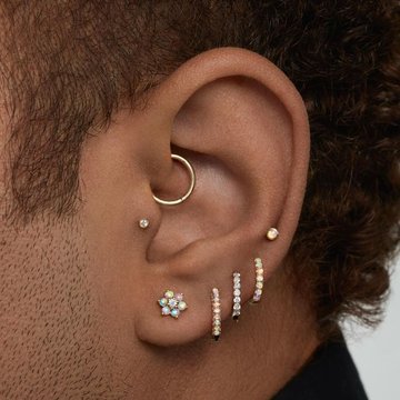 Low helix piercing for men